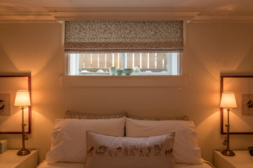 Light-filled interior with window coverings